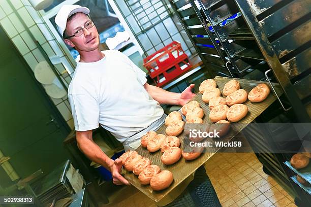 Baker With Fresh Baked Rolls Stock Photo - Download Image Now - Adult, Adults Only, Apron