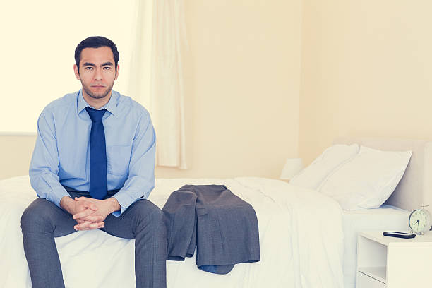 istock Stern man looking  sitting on his bed 502938737