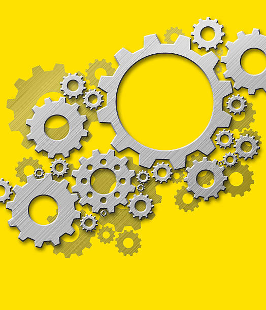 istock Metal gears design on yellow background 502940554