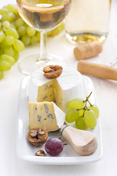 istock Camembert with Grapes and white wine, vertical 502943994