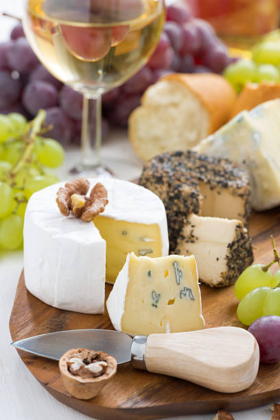 istock cheese platter, snacks, bread and wine, vertical, close-up 502944086