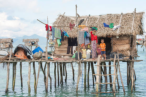 Daily life at Mabul Bodgaya island in Semporna. Sabah, Malaysia-November 24, 2014:Daily life at Mabul Bodgaya island in Semporna, Sabah, Malaysia. Most of the people here are sea gypsy people. mabul island stock pictures, royalty-free photos & images