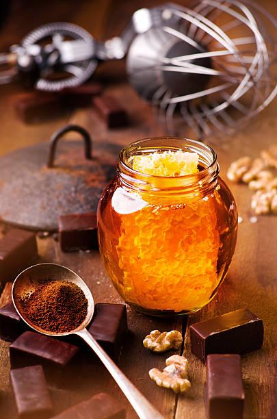 istock Jar of healthy real honey with honeycomb inside, 502947146