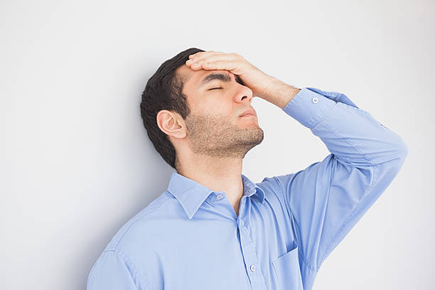 istock Irritated man with hand on forehead leaning against a wall 502952595