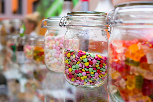 Gummies placed on a colorful background board.