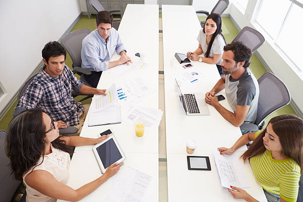 istock Hispanic Designers Meeting To Discuss New Ideas 502957387