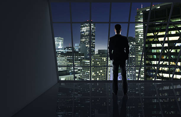 istock man looking to night city 502964304
