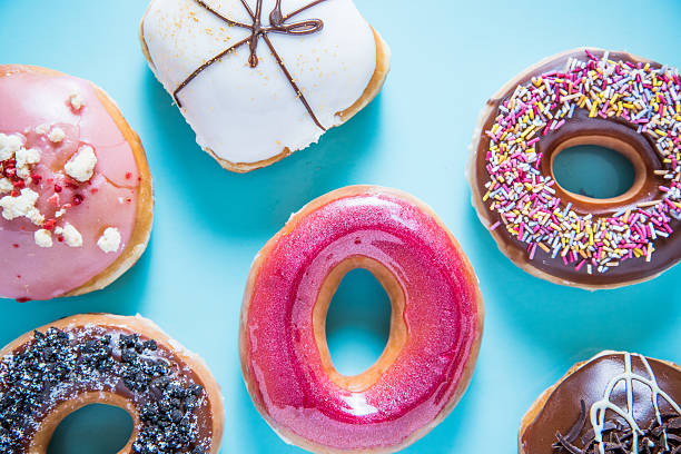 istock Vibrant artisan donuts on blue background 502964500