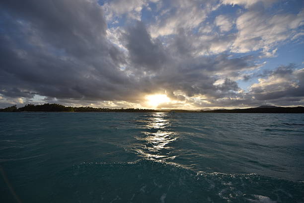 Cloudy Tropical Sunset at Water Level stock photo