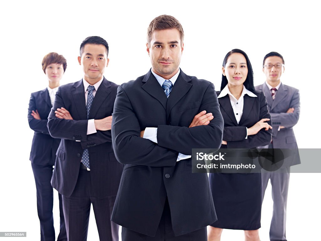 portrait of multinational business team studio portrait of a multinational business team, isolated on white background. Arms Crossed Stock Photo