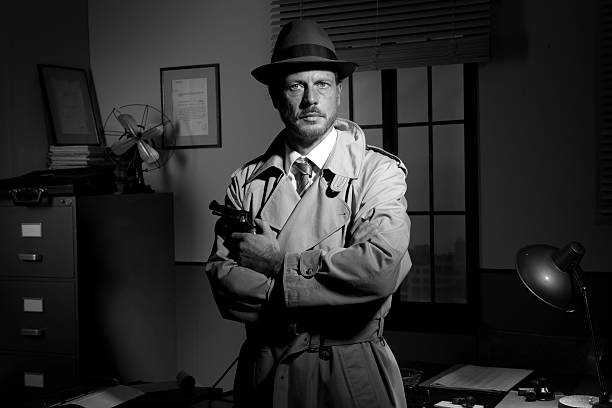 Attractive detective holding a revolver with retro office on background, film noir.