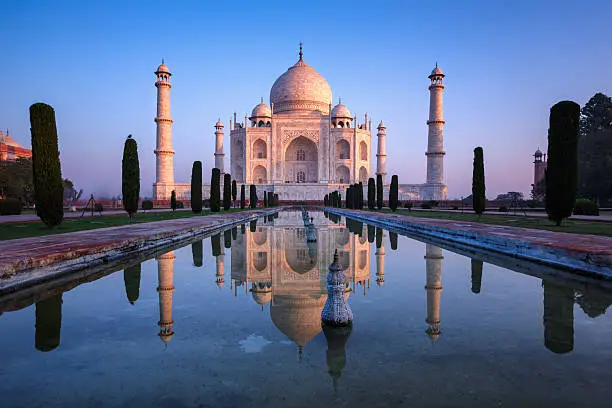 Taj Mahal refelct in sunrise colors.