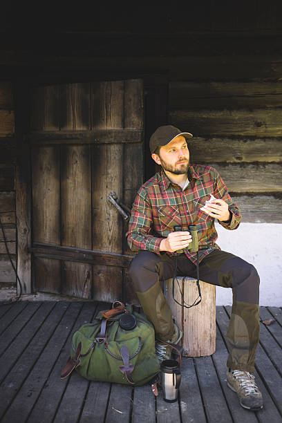 istock Man Having a Break at a Countryside House After Hiking 502969720