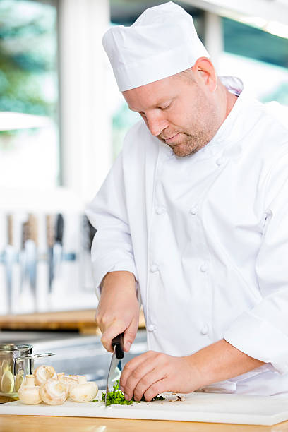 istock Professional chef preparing vegetables to a healthy dish 502970258