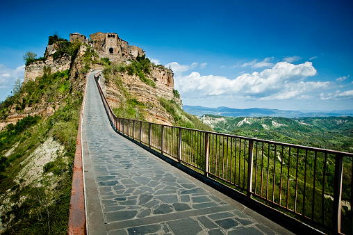 Shoot of the medieval town of Civita di Bagnoregio, with the long road to go in.