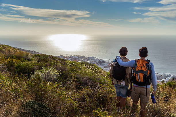 istock Male hikers looking at sea in forest 502970748