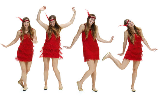Smiling four women dancing Smiling four women dancinghttp://www.twodozendesign.info/i/1.png sequence dress stock pictures, royalty-free photos & images