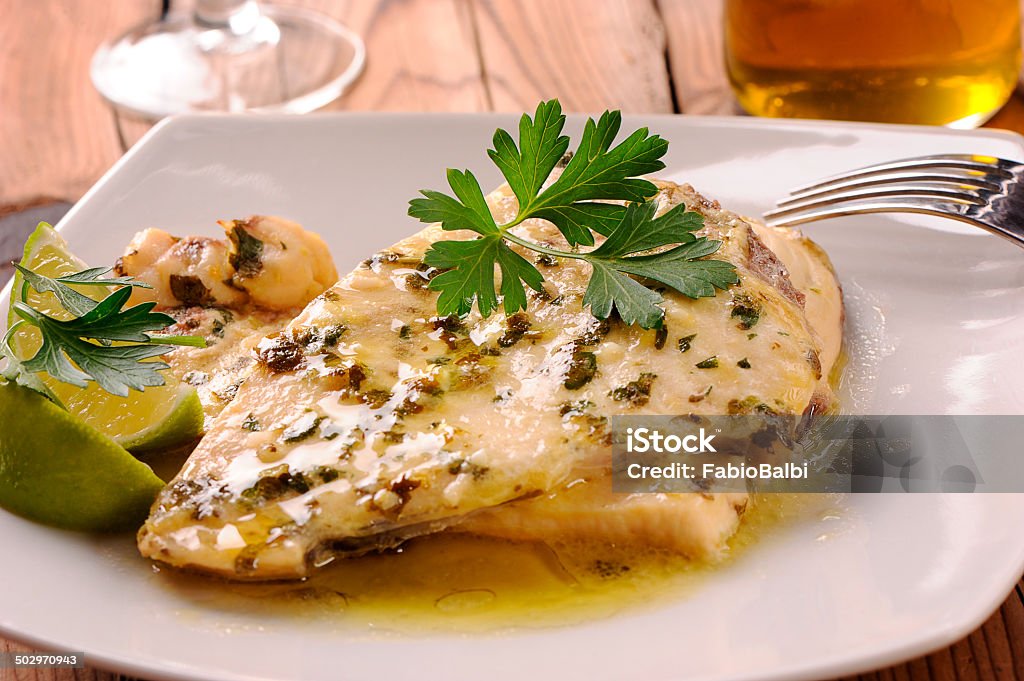 Swordfish on white plate Delicious dish with swordfish Close-up Stock Photo