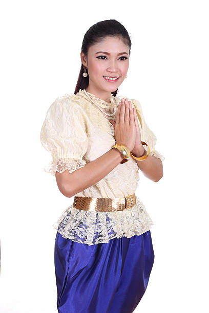 istock woman wearing typical thai dress pay respect 502971359