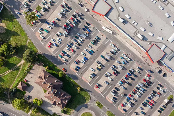 aerial view over crowded parking lot near supermarket in Poland