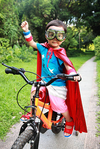 super hero Cute asia children super bike stock pictures, royalty-free photos & images