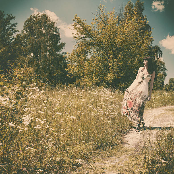 istock walking on the meadow, retro styled female portrait 502973805