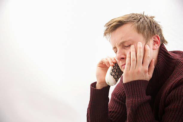 istock Young male making a telephone call loooking bored 502974428