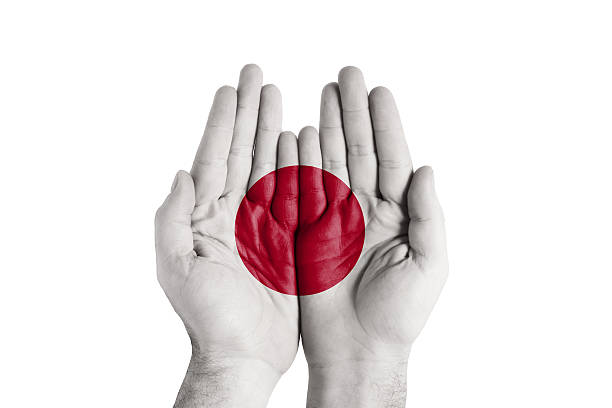 istock Human Handful Japan Flag Painted 502974581