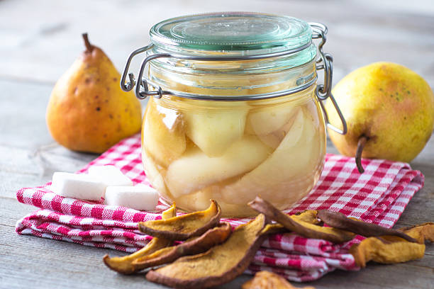 istock Preserved fruit.Homemade pears compote 502975344