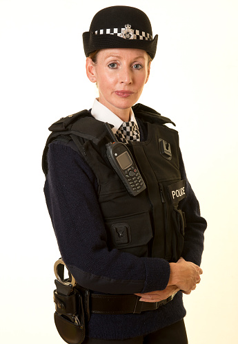 A young british female police officer in uniform