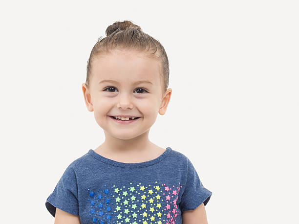 istock Cute toddler girl smiling over white 502975562