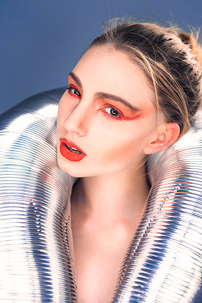 istock Creative makeup, girl with bright makeup on a blue background, 502975825