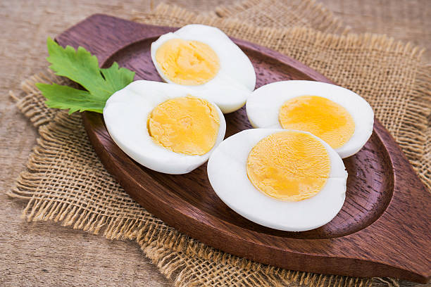istock Boiled eggs on wooden plate 502975971