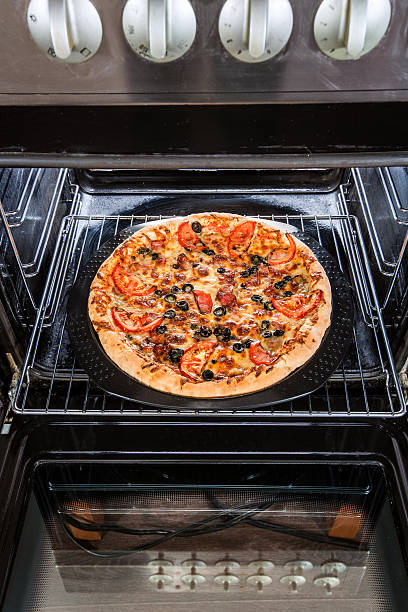 istock Pepperoni pizza in the oven. 502977521