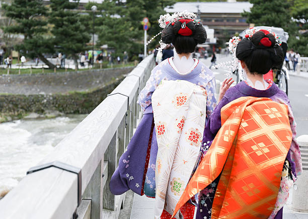 istock Two geisha walking on a bridge in Arashiyama, Japan 502977891
