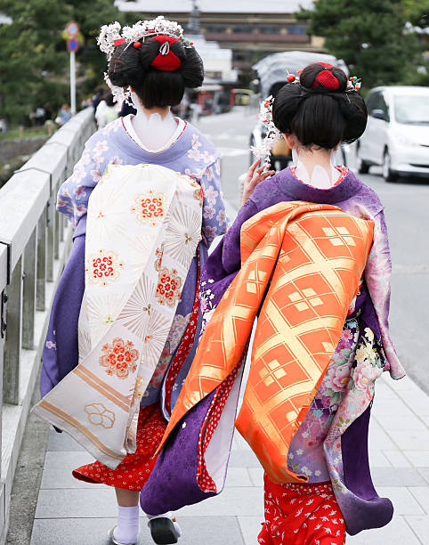 istock Two geisha walking on a bridge in Arashiyama, Japan 502977933