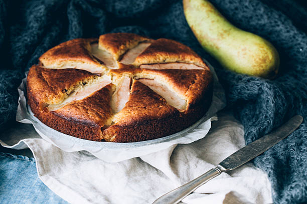 istock sweet biscuit cake with yellow pears 502990028