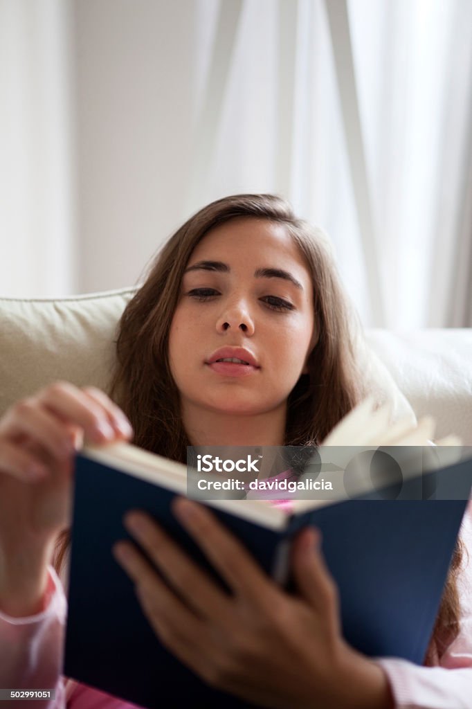 Teenage girl reading Adolescence Stock Photo