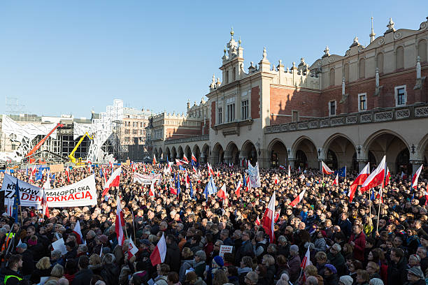 Cracow, Main Square - The demonstration Cracow, Poland - December 19, 2015: Cracow, Main Square -  The demonstration of the Committee of the  Protection of the Democracy /KOD/ against the break of law through the government PIS in Poland. solidarity labor union stock pictures, royalty-free photos & images