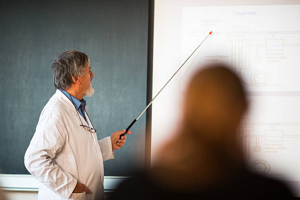 istock Senior chemistry professor giving a lecture 502991704