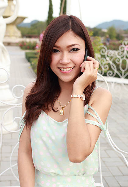 istock young woman talking on a mobile 502993085