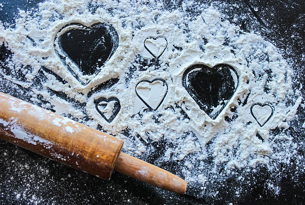 Hearts shape made with flour while cooking.