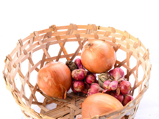 istock Onions with basket on white background 502994163