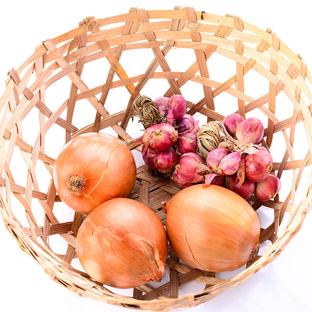 istock Onions with basket on white background 502994959