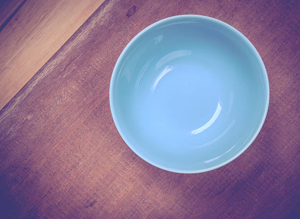 istock Round plate with blue on wood table 502995839