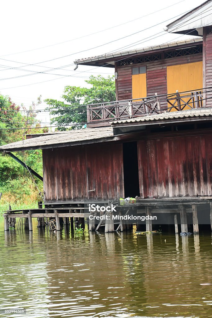 wood home near the river ,Thailand Arts Culture and Entertainment Stock Photo