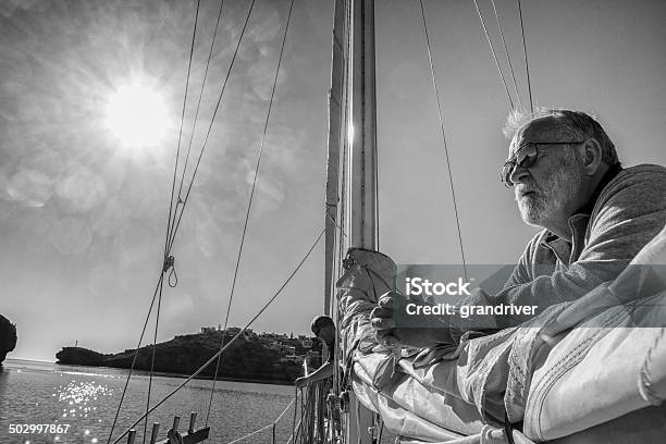 Man On Sailboat Stock Photo - Download Image Now - Business Person, Sailboat, Sailing