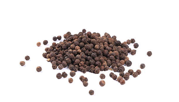 istock Heap of black spicy peppercorn. 502997883