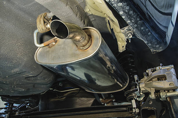 New Car Muffler The lower part of the new car and the muffler exhaust pipe photos stock pictures, royalty-free photos & images