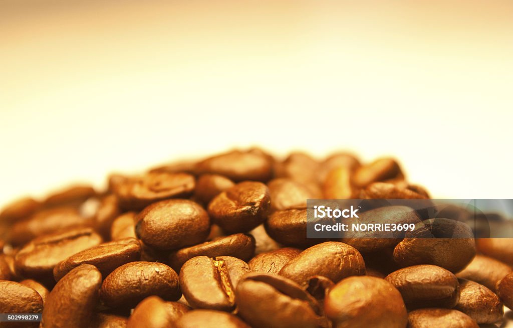 Fresh Coffee Wave A large heap / mound of fresh coffee beans.  Taken on a white background. Alcohol - Drink Stock Photo